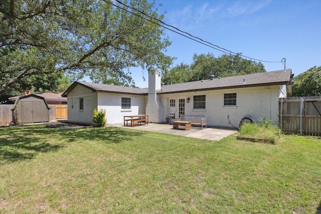 4632 Ivanhoe Dr, Fort Worth, TX 76132 - back of property with a patio, a storage unit, and a chimney