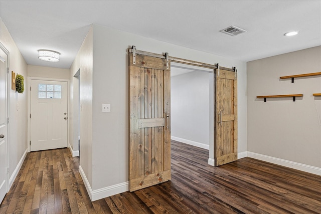4632 Ivanhoe Dr, Fort Worth, TX 76132 - entryway with a barn door, wood finished floors, and recessed lighting