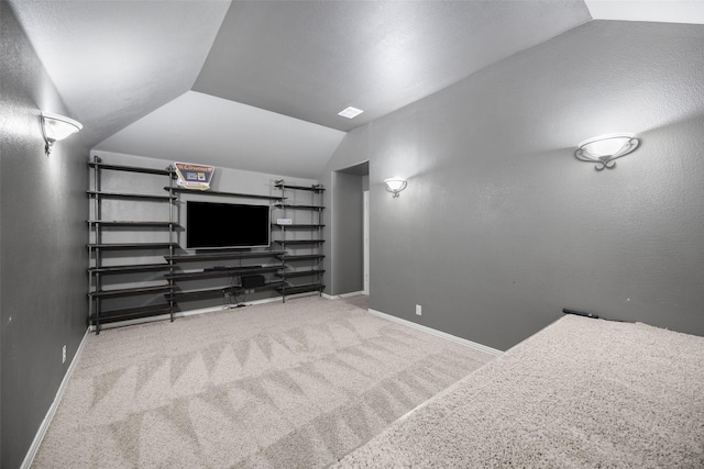 1020 Perennial Ln, Little Elm, TX 75068 - carpeted cinema room featuring vaulted ceiling and baseboards