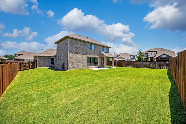 1020 Perennial Ln, Little Elm, TX 75068 - back of house featuring brick siding, a patio area, and a fenced backyard