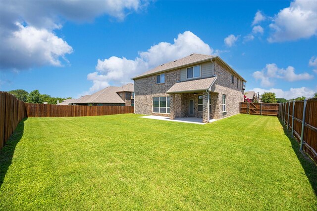 1020 Perennial Ln, Little Elm, TX 75068 - back of property featuring a patio area, a fenced backyard, and brick siding