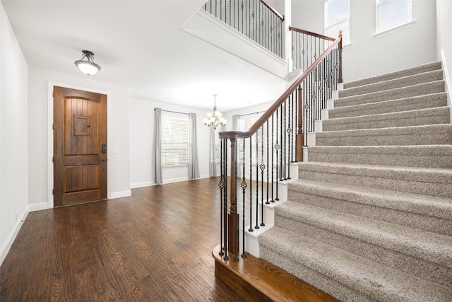 1020 Perennial Ln, Little Elm, TX 75068 - foyer entrance with a chandelier, stairs, and wood finished floors