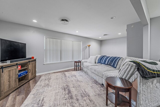 1007 College Ave, Glen Rose, TX 76043 - living room featuring dark wood-type flooring and recessed lighting