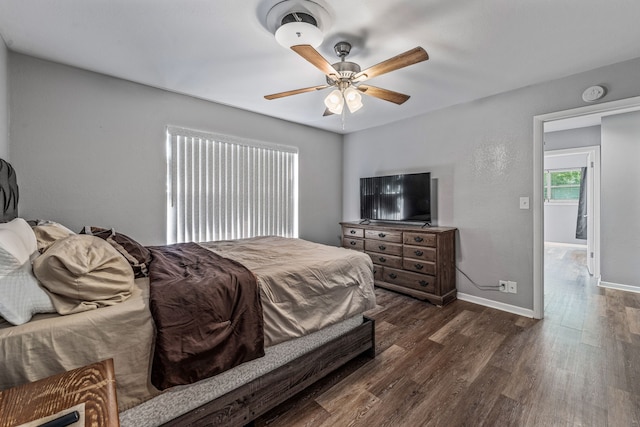 1007 College Ave, Glen Rose, TX 76043 - bedroom with dark wood-type flooring and ceiling fan