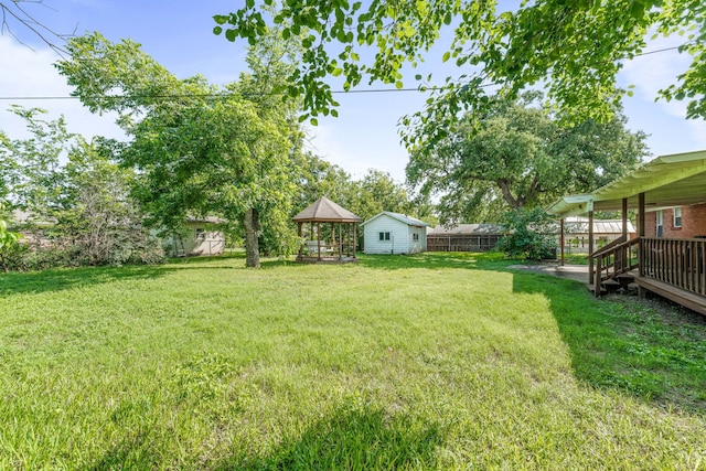 1007 College Ave, Glen Rose, TX 76043 - fenced backyard with a gazebo and a wooden deck