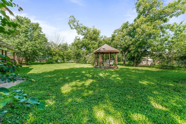 1007 College Ave, Glen Rose, TX 76043 - fenced backyard with a gazebo