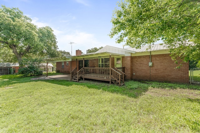 1007 College Ave, Glen Rose, TX 76043 - back of house with brick siding and a chimney