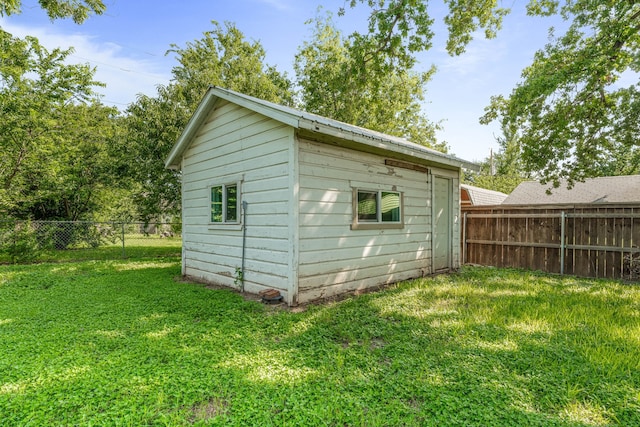 1007 College Ave, Glen Rose, TX 76043 - view of outbuilding with a fenced backyard