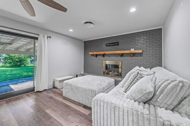 1007 College Ave, Glen Rose, TX 76043 - living area with wood finished floors, a fireplace, a ceiling fan, and recessed lighting