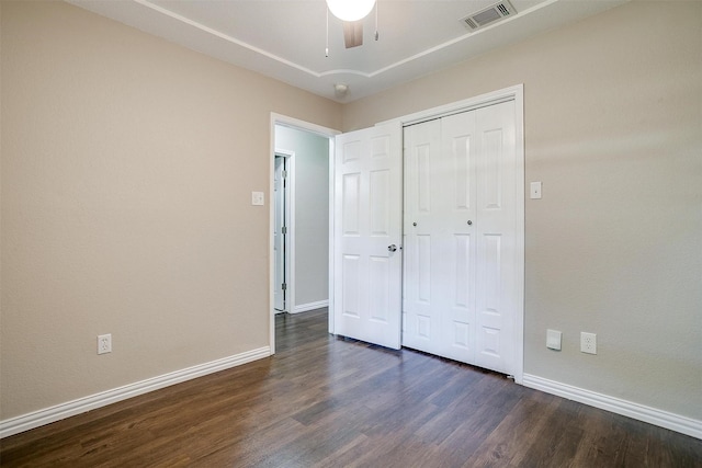 555 Meadowbrook Dr, Burleson, TX 76028 - unfurnished bedroom with dark wood-type flooring, a closet, and ceiling fan