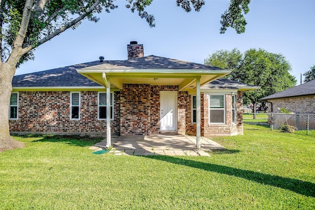 555 Meadowbrook Dr, Burleson, TX 76028 - back of property featuring brick siding, a chimney, a patio, and a shingled roof