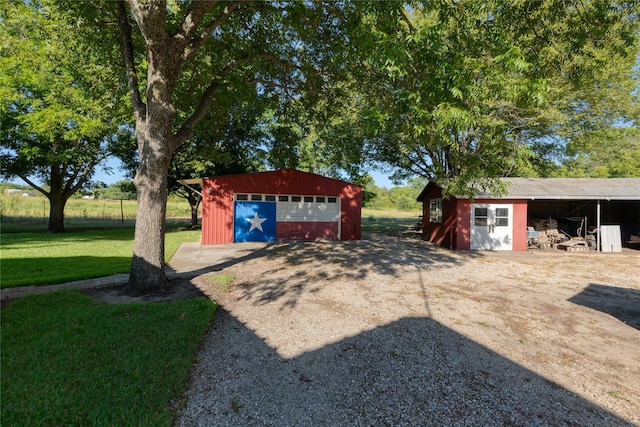 4525 Midway Rd, Weatherford, TX 76085 - view of grassy yard with a garage and an outdoor structure