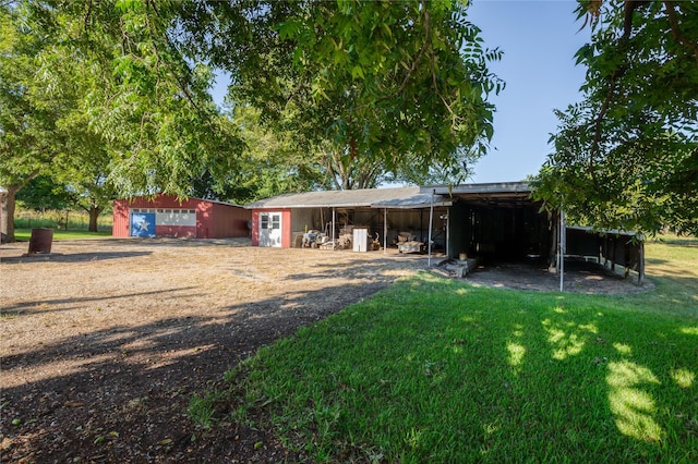 4525 Midway Rd, Weatherford, TX 76085 - back of property featuring an outbuilding and a yard