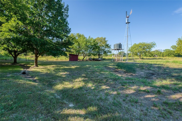 4525 Midway Rd, Weatherford, TX 76085 - view of grassy yard featuring a storage shed