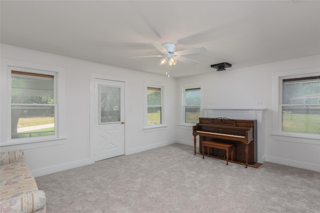 4525 Midway Rd, Weatherford, TX 76085 - sitting room featuring light colored carpet, healthy amount of natural light, and ceiling fan