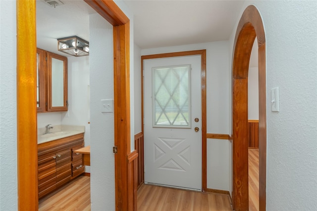 4525 Midway Rd, Weatherford, TX 76085 - doorway to outside with light wood-style flooring and a sink
