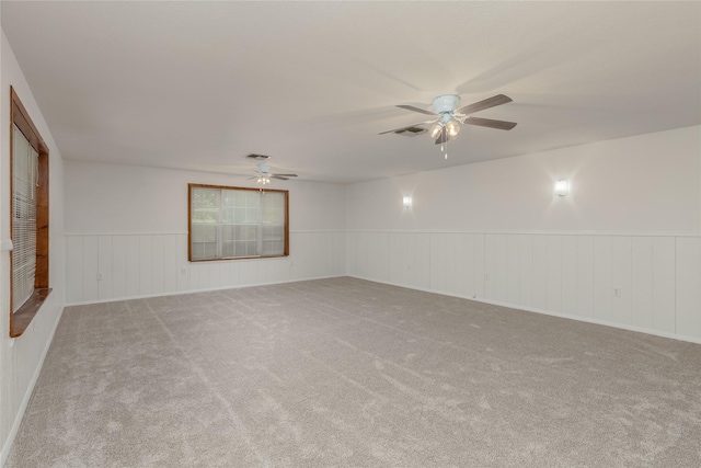 4525 Midway Rd, Weatherford, TX 76085 - carpeted spare room featuring ceiling fan and a wainscoted wall