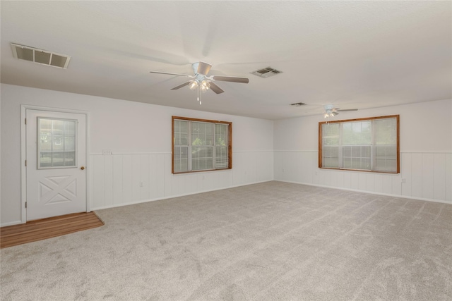 4525 Midway Rd, Weatherford, TX 76085 - empty room featuring ceiling fan, carpet, and a wainscoted wall