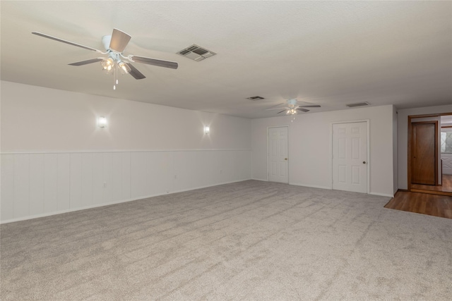4525 Midway Rd, Weatherford, TX 76085 - carpeted empty room with a ceiling fan and a wainscoted wall