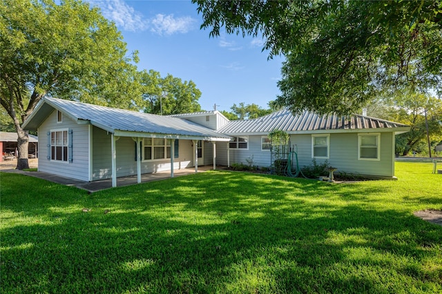 4525 Midway Rd, Weatherford, TX 76085 - rear view of property featuring a yard, a metal roof, and a patio