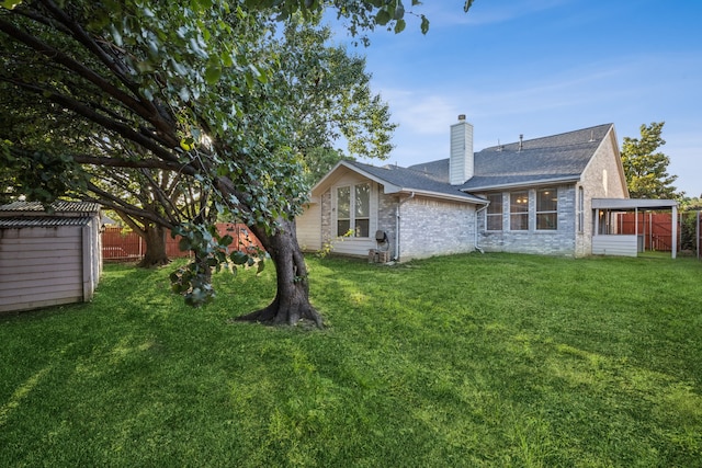 3341 Woodglen Dr, Mckinney, TX 75071 - rear view of house featuring a chimney, brick siding, a shingled roof, and a sunroom