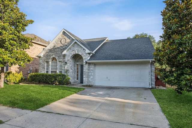 3341 Woodglen Dr, Mckinney, TX 75071 - view of front of house with a garage, a front yard, driveway, and roof with shingles