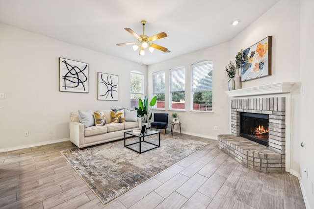 3341 Woodglen Dr, Mckinney, TX 75071 - living area featuring a ceiling fan, wood finished floors, and a fireplace
