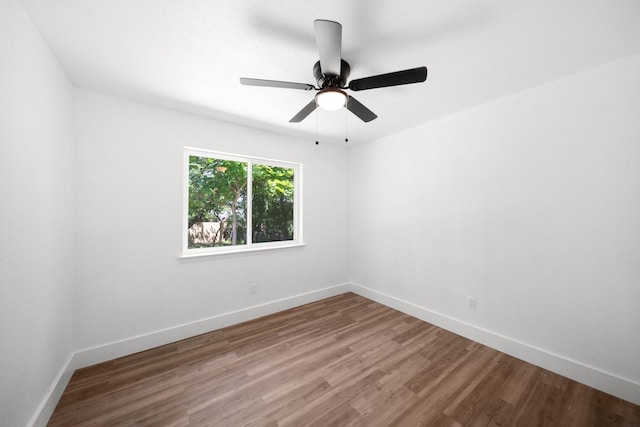 1214 Cove Dr, Garland, TX 75040 - empty room featuring wood finished floors and ceiling fan