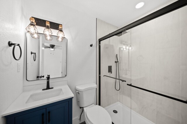 1214 Cove Dr, Garland, TX 75040 - full bath featuring a ceiling fan, a tile shower, and vanity