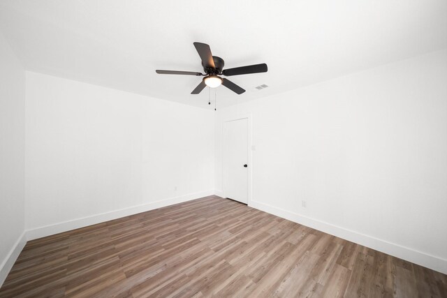 1214 Cove Dr, Garland, TX 75040 - unfurnished room featuring wood finished floors and a ceiling fan