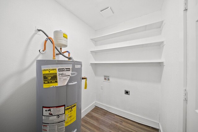 1214 Cove Dr, Garland, TX 75040 - utility room featuring electric water heater
