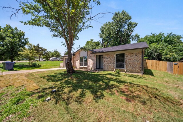 1214 Cove Dr, Garland, TX 75040 - view of front of house featuring brick siding and a garage