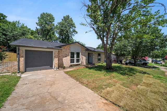 1214 Cove Dr, Garland, TX 75040 - view of front facade with an attached garage, driveway, and brick siding