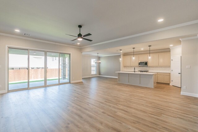213 Navajo Trl, Alvarado, TX 76009 - unfurnished living room with a ceiling fan, recessed lighting, light wood-style floors, and ornamental molding
