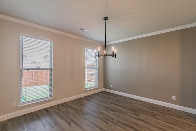 213 Navajo Trl, Alvarado, TX 76009 - spare room featuring a chandelier, ornamental molding, and dark wood-style floors