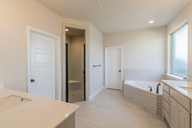213 Navajo Trl, Alvarado, TX 76009 - full bath featuring vanity, a bath, a shower stall, and recessed lighting