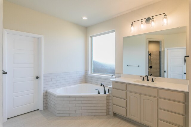 213 Navajo Trl, Alvarado, TX 76009 - full bath with a bath, vanity, a shower stall, and recessed lighting