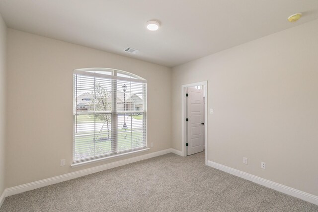 213 Navajo Trl, Alvarado, TX 76009 - empty room with light carpet and a smoke detector