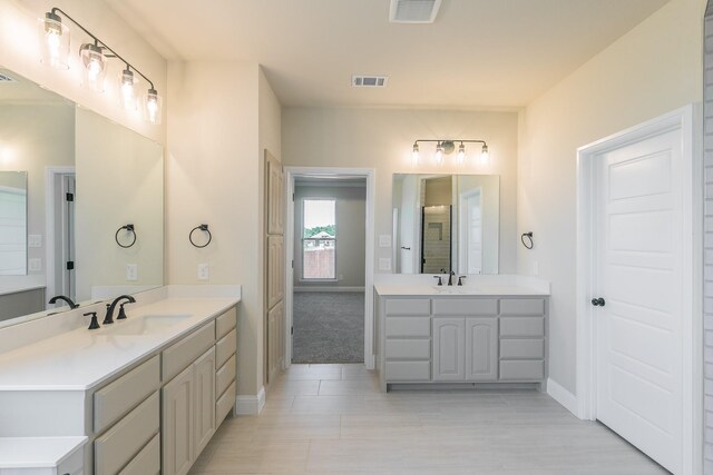 213 Navajo Trl, Alvarado, TX 76009 - full bath with two vanities and baseboards