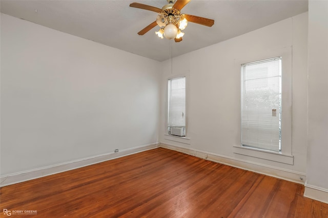 538 Dalzell St, Shreveport, LA 71104 - spare room featuring wood finished floors, a ceiling fan, and healthy amount of natural light