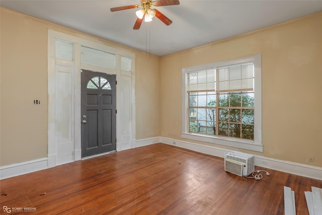 538 Dalzell St, Shreveport, LA 71104 - foyer featuring a ceiling fan, wood finished floors, a wall unit AC, and crown molding