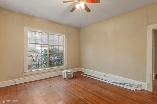 538 Dalzell St, Shreveport, LA 71104 - spare room with a ceiling fan, wood-type flooring, and ornamental molding