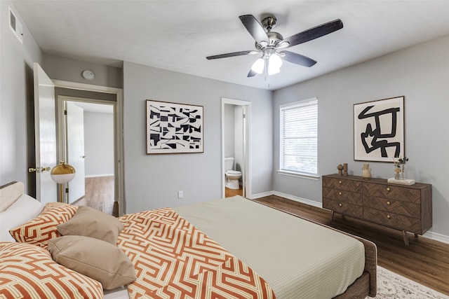3209 Pecan Ln, Garland, TX 75041 - bedroom featuring wood finished floors, connected bathroom, and a ceiling fan