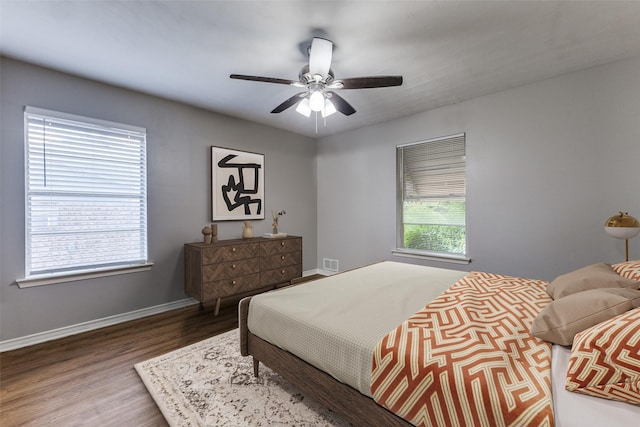 3209 Pecan Ln, Garland, TX 75041 - bedroom with wood finished floors and a ceiling fan