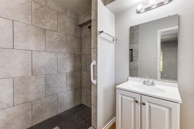 3209 Pecan Ln, Garland, TX 75041 - full bathroom featuring a tile shower and vanity