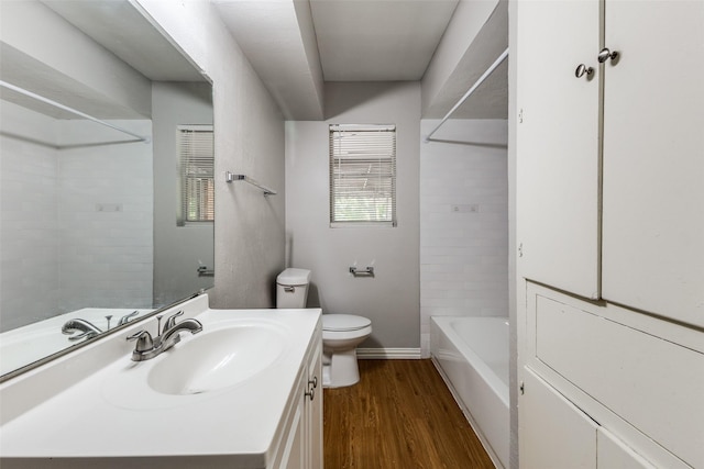 3209 Pecan Ln, Garland, TX 75041 - bathroom with vanity, wood finished floors, and  shower combination