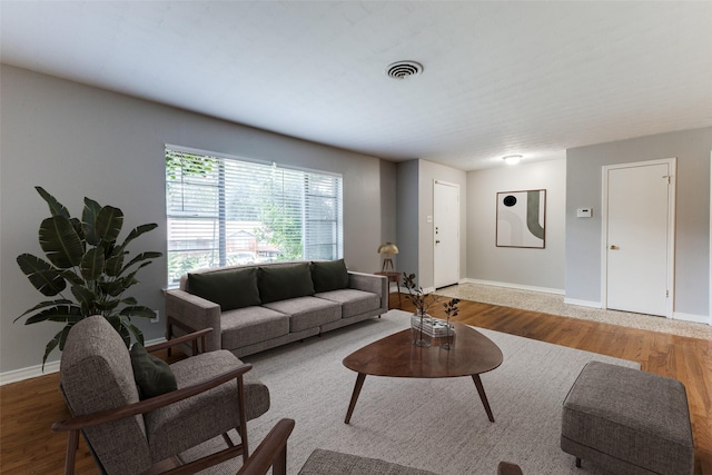 3209 Pecan Ln, Garland, TX 75041 - living area with wood finished floors and baseboards