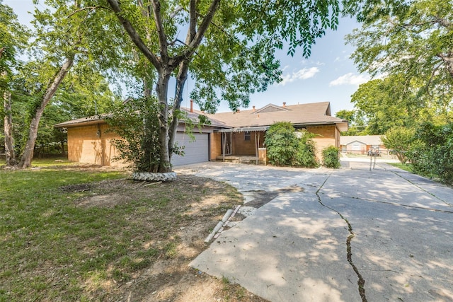 3209 Pecan Ln, Garland, TX 75041 - single story home with driveway and an attached garage