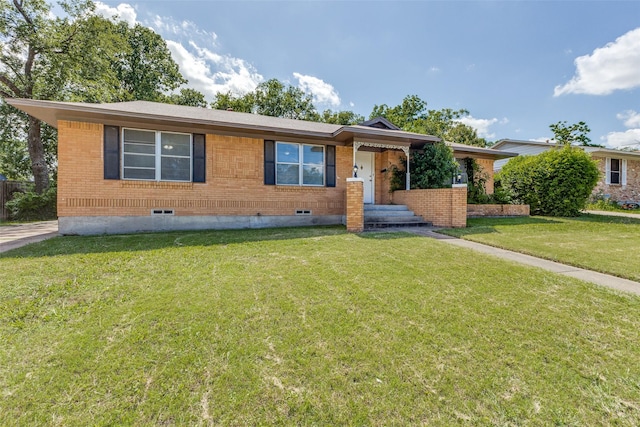 3209 Pecan Ln, Garland, TX 75041 - view of front facade featuring a front lawn, crawl space, and brick siding