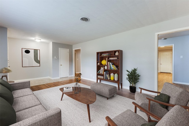 3209 Pecan Ln, Garland, TX 75041 - living room with light wood-style floors and baseboards